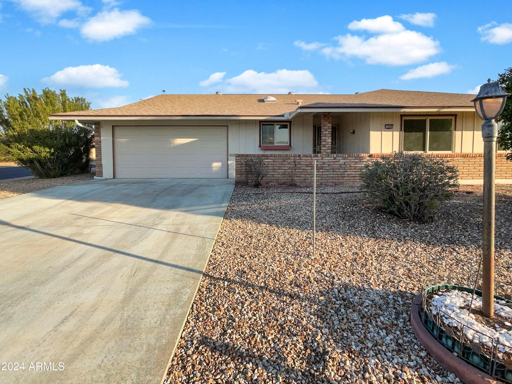 ranch-style house featuring a garage