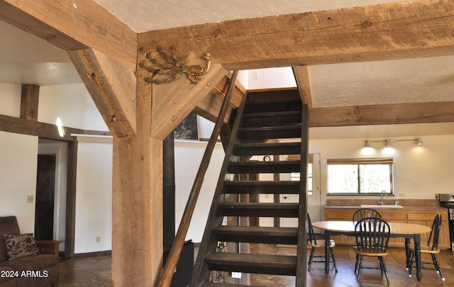 staircase featuring sink