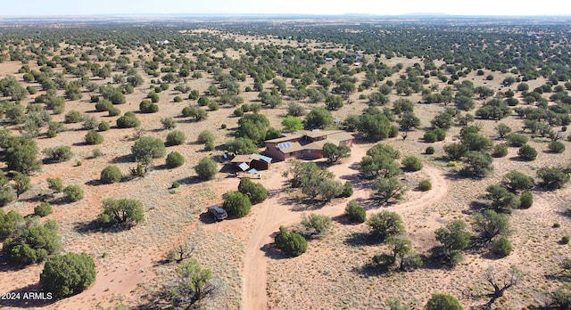 birds eye view of property with a rural view