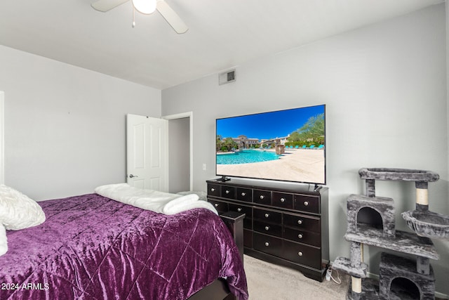 bedroom with light colored carpet and ceiling fan