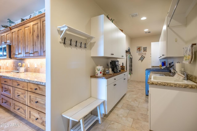 965 Calle Azul, Wickenburg, AZ 85390 - kitchen with a sink, decorative backsplash, stainless steel microwave, recessed lighting, and light tile patterned flooring