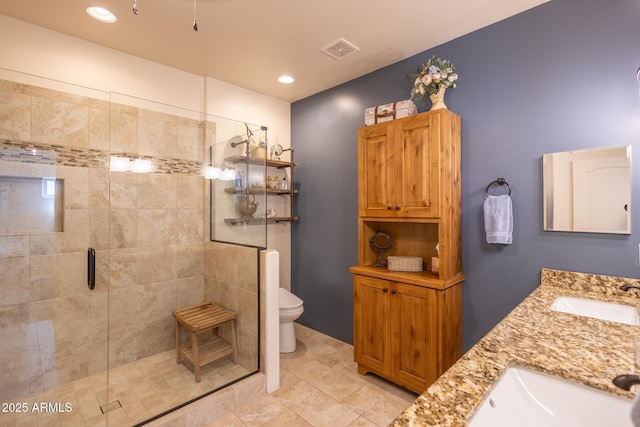 965 Calle Azul, Wickenburg, AZ 85390 - bathroom featuring a stall shower, toilet, double vanity, recessed lighting, and tile patterned floors