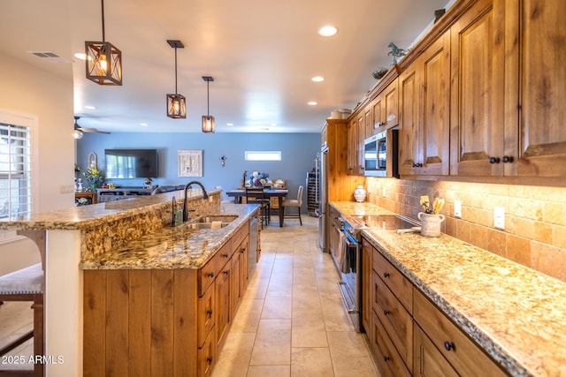 965 Calle Azul, Wickenburg, AZ 85390 - kitchen with a sink, appliances with stainless steel finishes, brown cabinets, recessed lighting, and backsplash