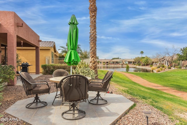 view of patio / terrace with a water view