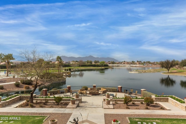 view of water feature featuring a fire pit and a mountain view