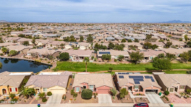 bird's eye view with a residential view and a water view