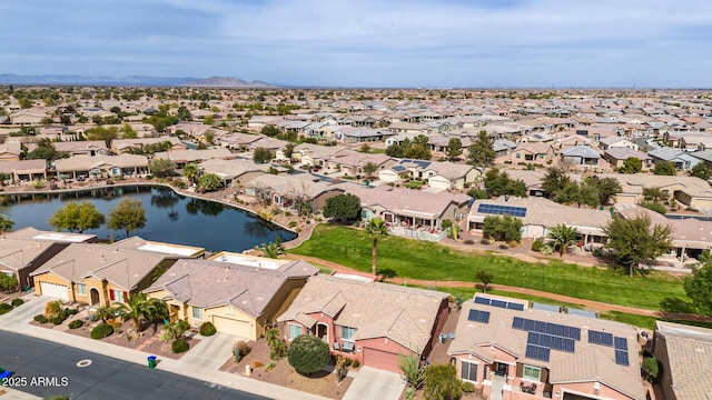 bird's eye view with a residential view and a water view