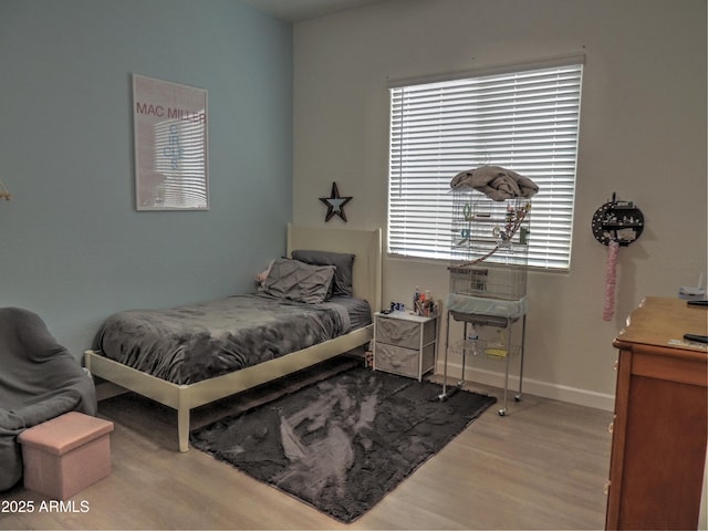 21696 E Arroyo Verde Dr, Queen Creek, AZ 85142 - bedroom featuring baseboards and wood finished floors