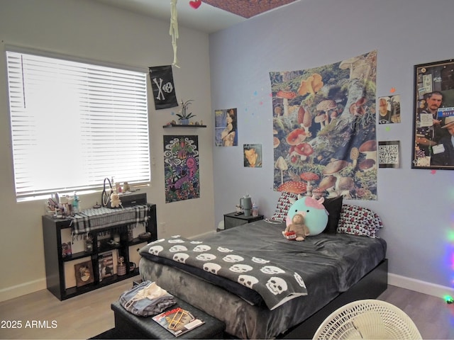 21696 E Arroyo Verde Dr, Queen Creek, AZ 85142 - bedroom with baseboards and wood finished floors