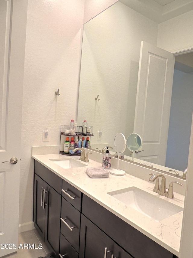 21696 E Arroyo Verde Dr, Queen Creek, AZ 85142 - bathroom with tile patterned floors, double vanity, and a sink
