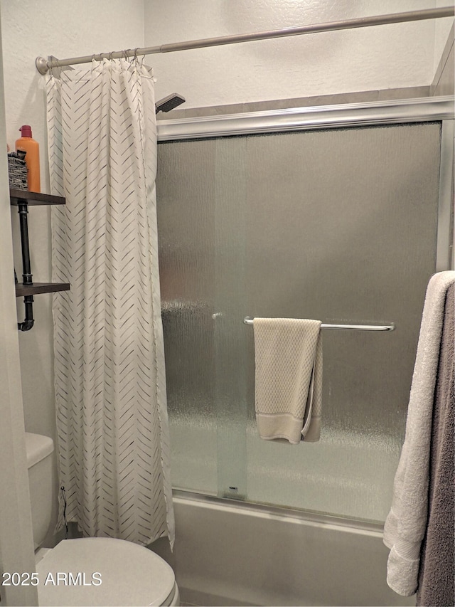 21696 E Arroyo Verde Dr, Queen Creek, AZ 85142 - bathroom with toilet and enclosed tub / shower combo