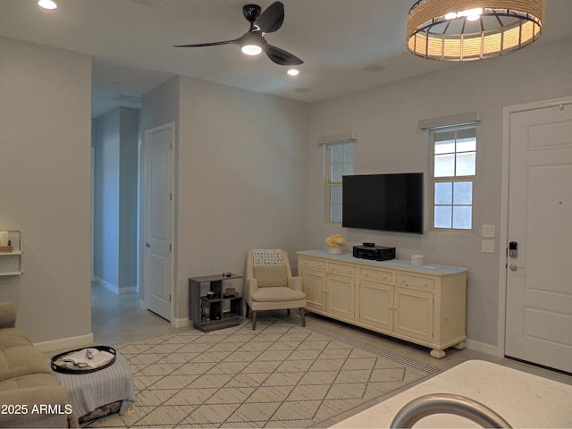 21696 E Arroyo Verde Dr, Queen Creek, AZ 85142 - living room featuring ceiling fan, baseboards, and recessed lighting