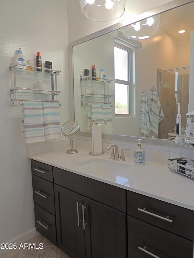 21696 E Arroyo Verde Dr, Queen Creek, AZ 85142 - bathroom with a shower stall, vanity, and baseboards