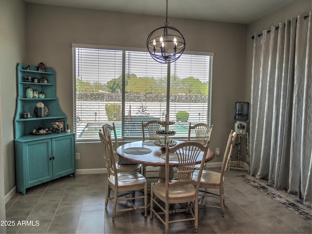 21696 E Arroyo Verde Dr, Queen Creek, AZ 85142 - dining area featuring a chandelier, light tile patterned floors, and baseboards