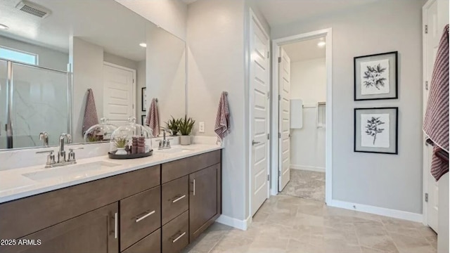 23081 E Saddle Way, Queen Creek, AZ 85142 - full bath with double vanity, baseboards, a closet, an enclosed shower, and recessed lighting