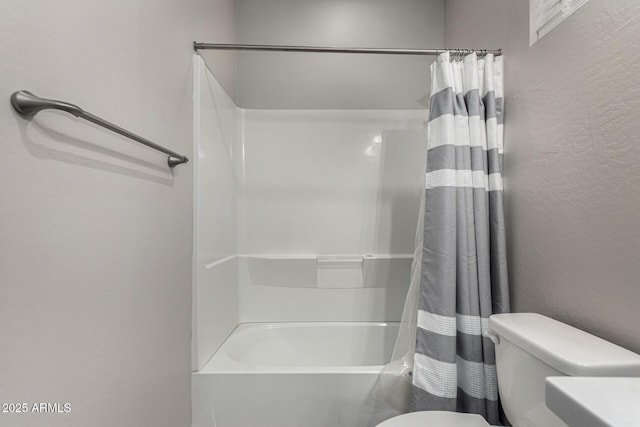 bathroom with toilet and shower / tub combo