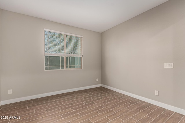 empty room with light hardwood / wood-style flooring