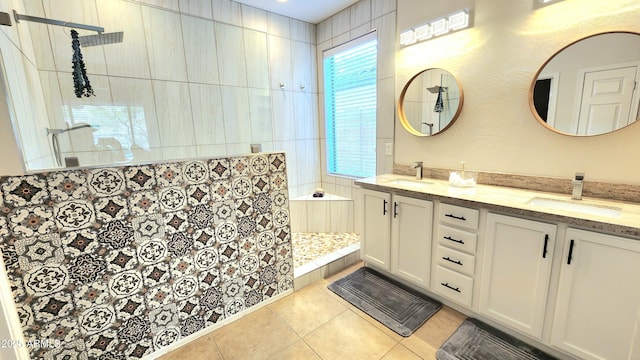 bathroom featuring a sink, a walk in shower, and tile patterned flooring