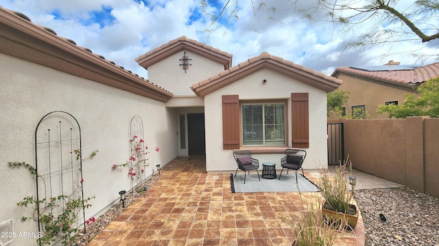 view of patio featuring fence