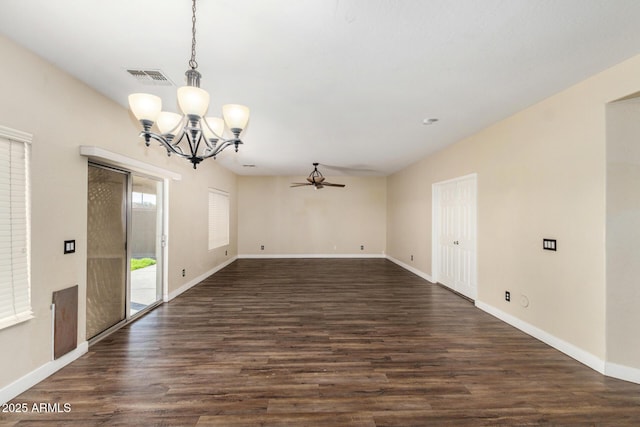 interior space featuring ceiling fan with notable chandelier and dark hardwood / wood-style flooring