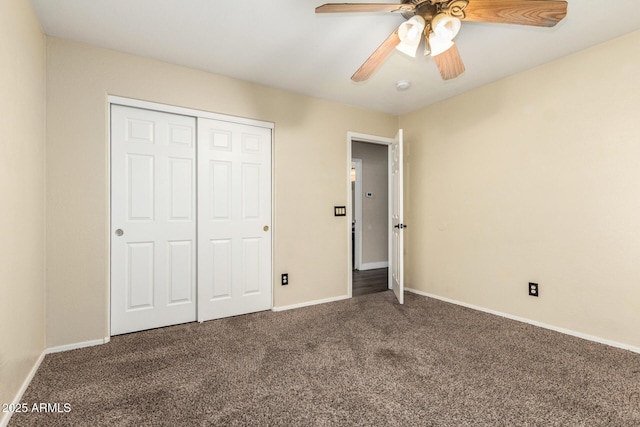 unfurnished bedroom featuring a closet, ceiling fan, and dark colored carpet