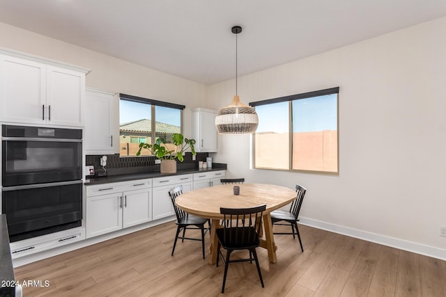 dining space with light hardwood / wood-style flooring