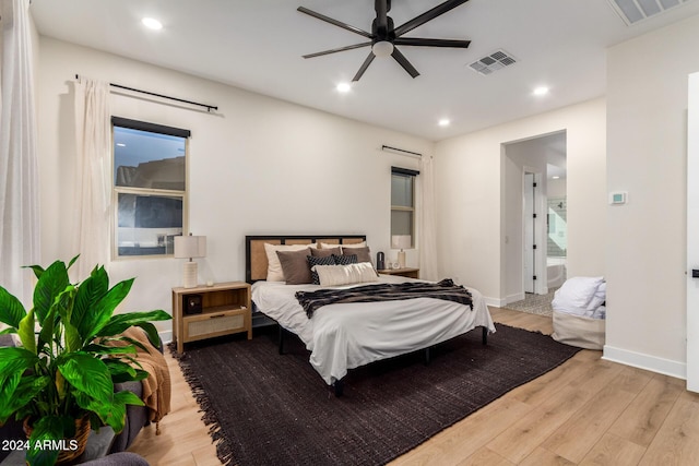 bedroom with ceiling fan and light hardwood / wood-style floors