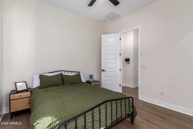 bedroom featuring ceiling fan and dark hardwood / wood-style floors