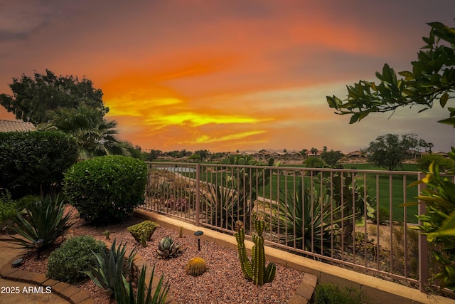 11553 W Cottontail Ct, Surprise, AZ 85378 - yard at dusk with a water view