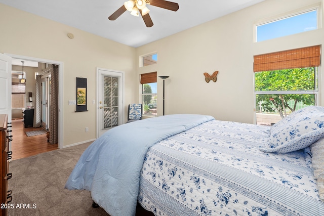 11553 W Cottontail Ct, Surprise, AZ 85378 - bedroom with carpet floors, multiple windows, baseboards, and ceiling fan