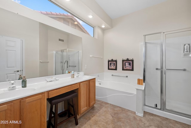 11553 W Cottontail Ct, Surprise, AZ 85378 - full bath featuring a shower stall, a garden tub, double vanity, and recessed lighting