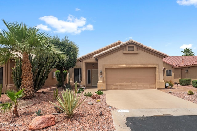 11553 W Cottontail Ct, Surprise, AZ 85378 - view of front of property featuring concrete driveway, a garage, stucco siding, and a tile roof
