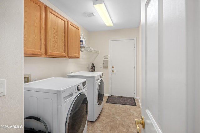 11553 W Cottontail Ct, Surprise, AZ 85378 - washroom with separate washer and dryer, cabinet space, and light tile patterned floors