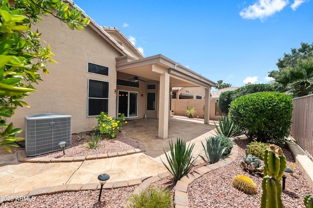 11553 W Cottontail Ct, Surprise, AZ 85378 - rear view of property with ceiling fan, central AC, stucco siding, and a fenced backyard