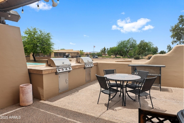 11553 W Cottontail Ct, Surprise, AZ 85378 - view of patio with a grill, area for grilling, and outdoor dining area