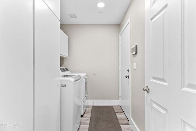 8848 E Conquistadores Dr, Scottsdale, AZ 85255 - washroom featuring washer and dryer, cabinet space, and light wood-style floors