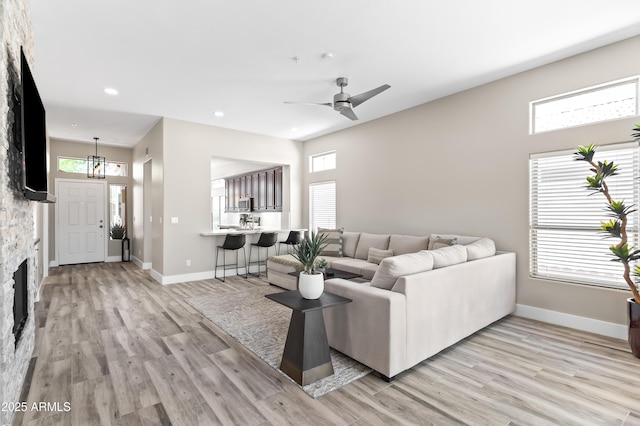8848 E Conquistadores Dr, Scottsdale, AZ 85255 - living area with plenty of natural light, light wood-type flooring, a ceiling fan, and recessed lighting