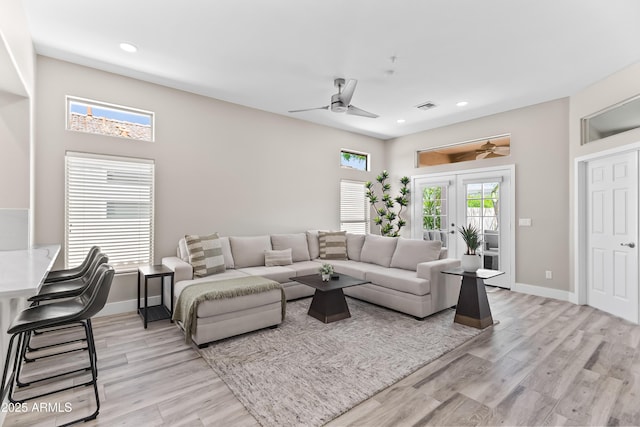 8848 E Conquistadores Dr, Scottsdale, AZ 85255 - living room with ceiling fan, recessed lighting, light wood finished floors, and french doors