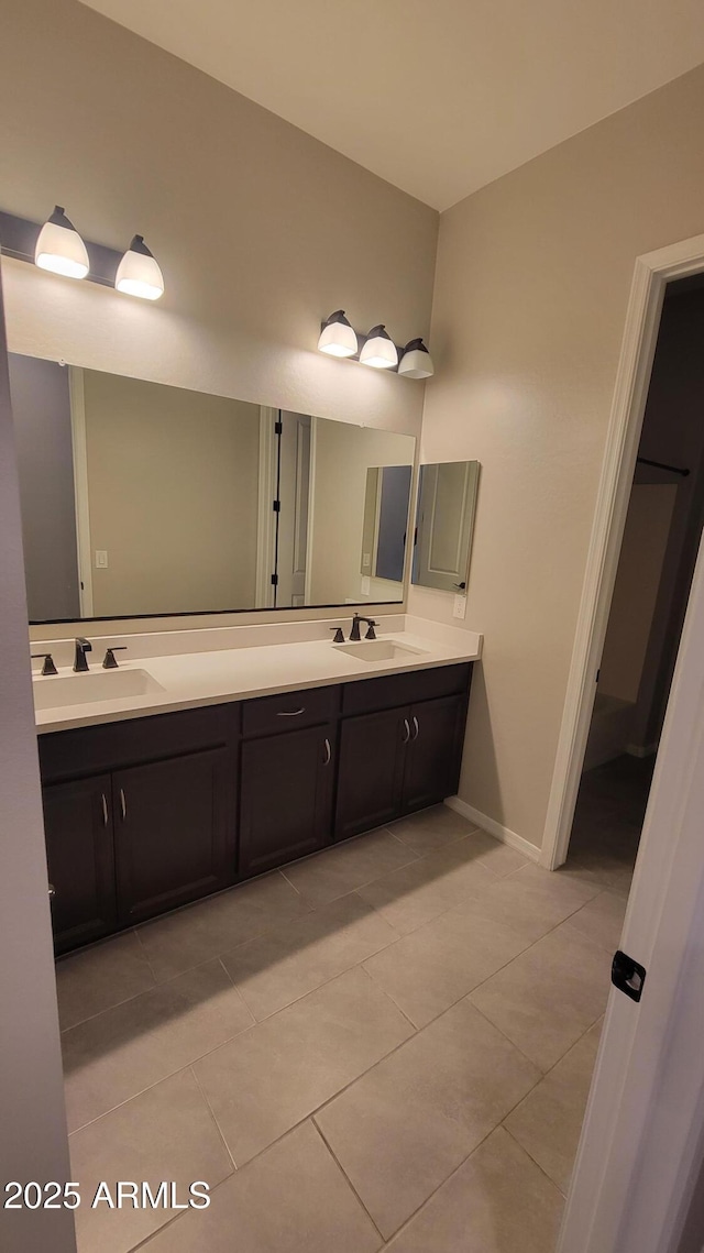 bathroom with tile patterned flooring and vanity