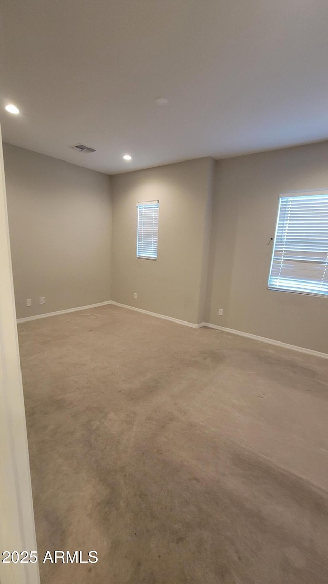 unfurnished room with carpet flooring