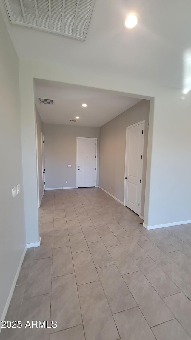 spare room with light tile patterned floors