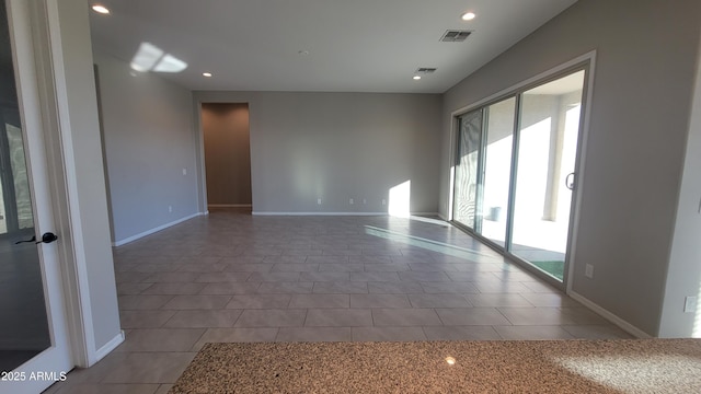 empty room featuring tile patterned floors