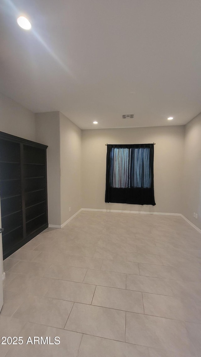 view of tiled spare room