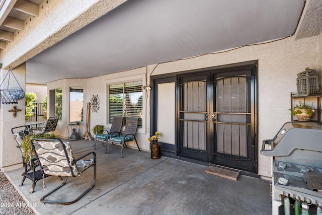 entrance to property with a patio area