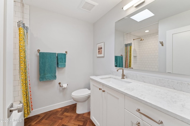 bathroom with vanity, parquet flooring, a shower with shower curtain, and toilet