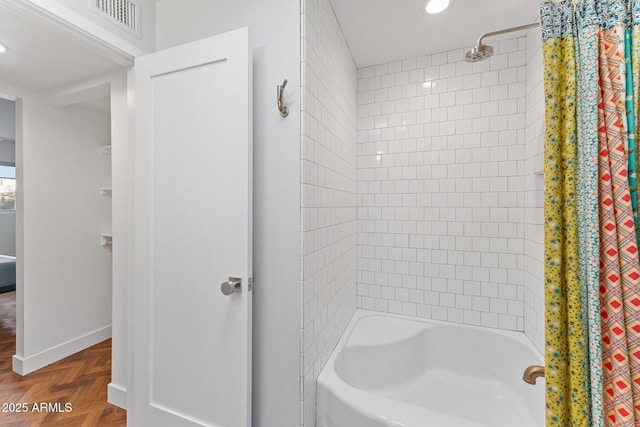 bathroom with shower / bathtub combination with curtain and parquet floors