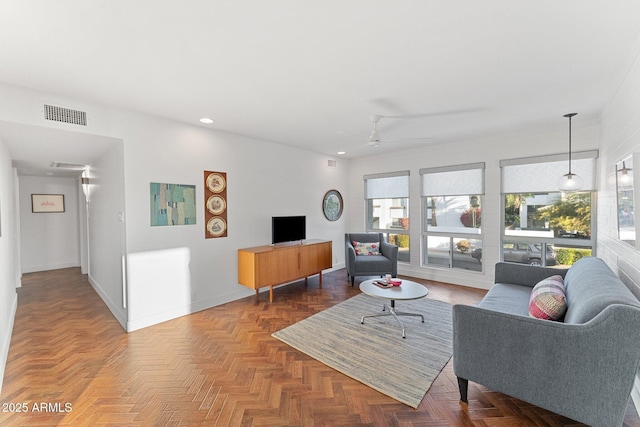 living room with parquet flooring and ceiling fan