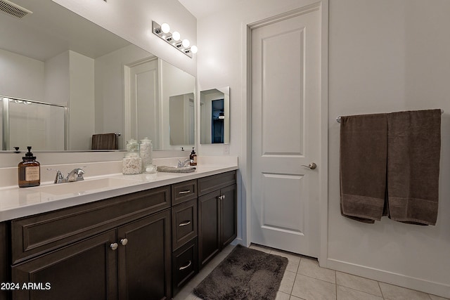 bathroom featuring tile patterned floors and vanity