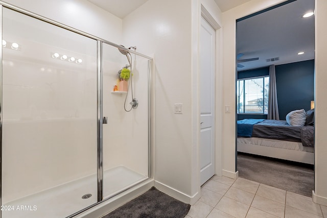 bathroom featuring tile patterned flooring and a shower with door