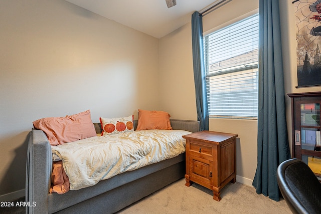 bedroom with light colored carpet